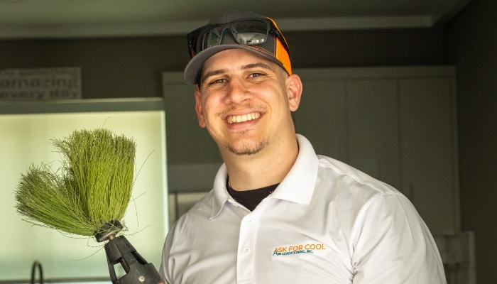 Smiling Technician With Duct Cleaning Brush Smiling Technician With Duct Cleaning Brush