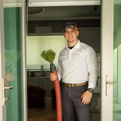 Technician Holding Duct Cleaning Equipement